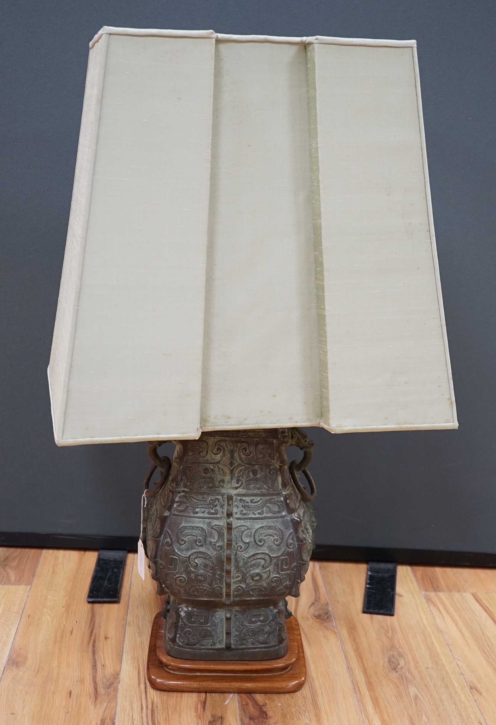 A Chinese archaistic bronze ‘zun’ lamp base, 84cm high including shade